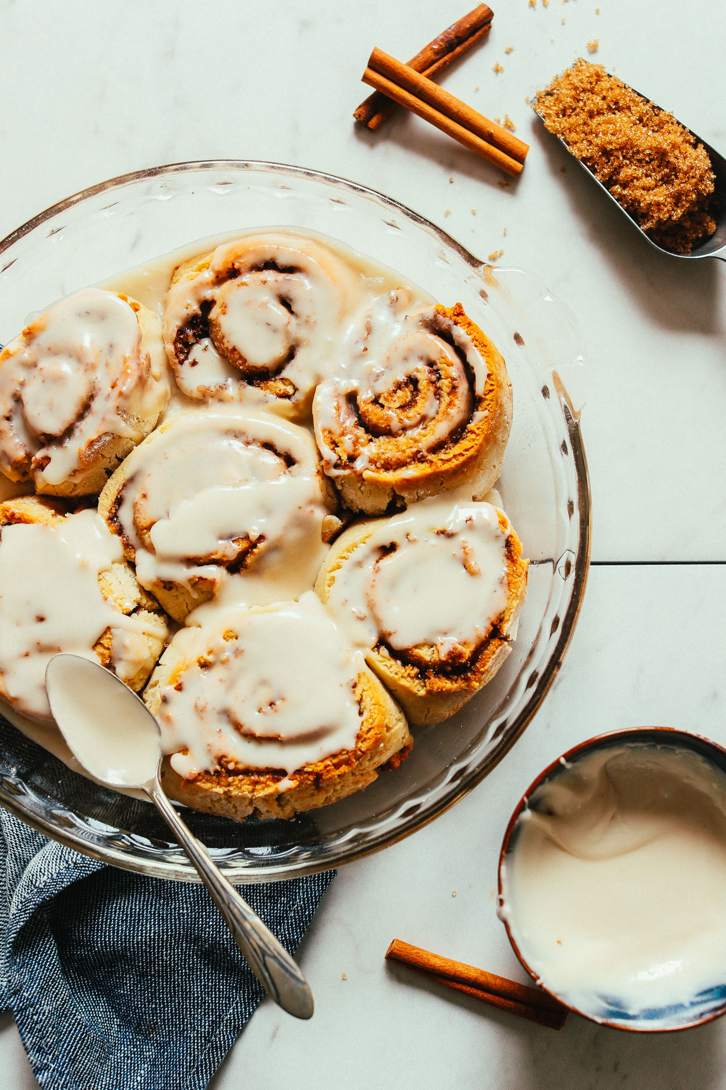 Pan of freshly baked Vegan Gluten Free Cinnamon Rolls topped with icing
