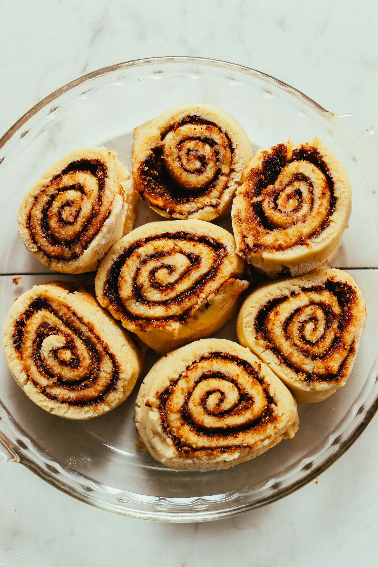 Pan of freshly risen Vegan Gluten Free Cinnamon Rolls ready to go in the oven