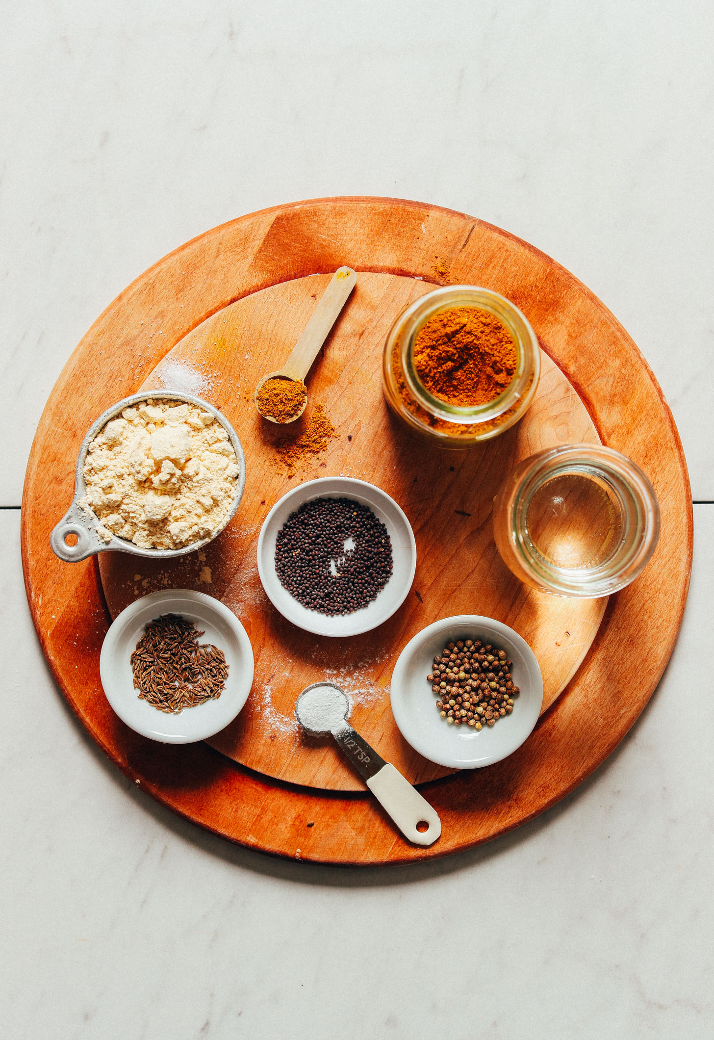 Cutting board filled with ingredients for making our vegan Curried Socca recipe