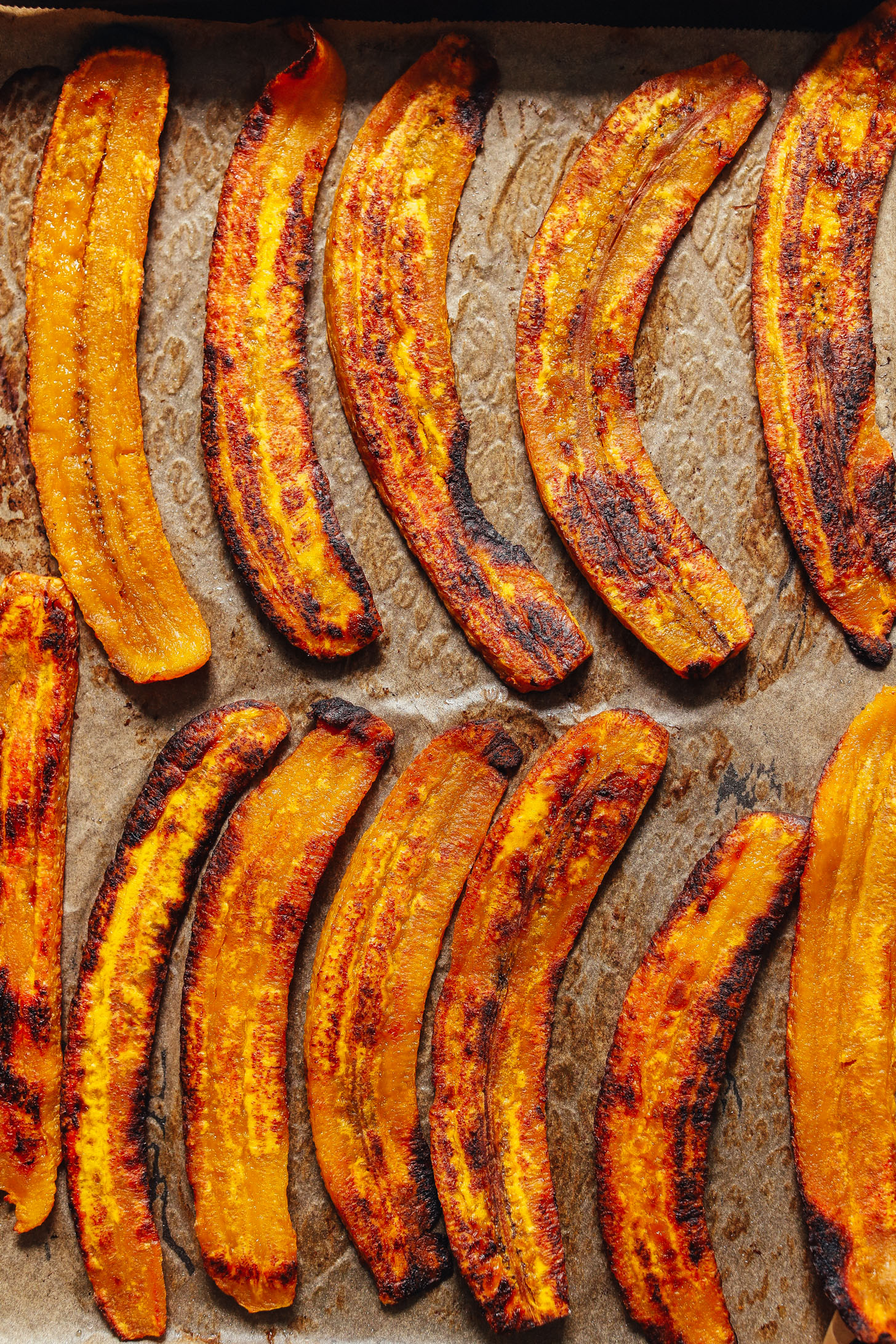 Tray filled with freshly baked plantains for making homemade vegan enchiladas