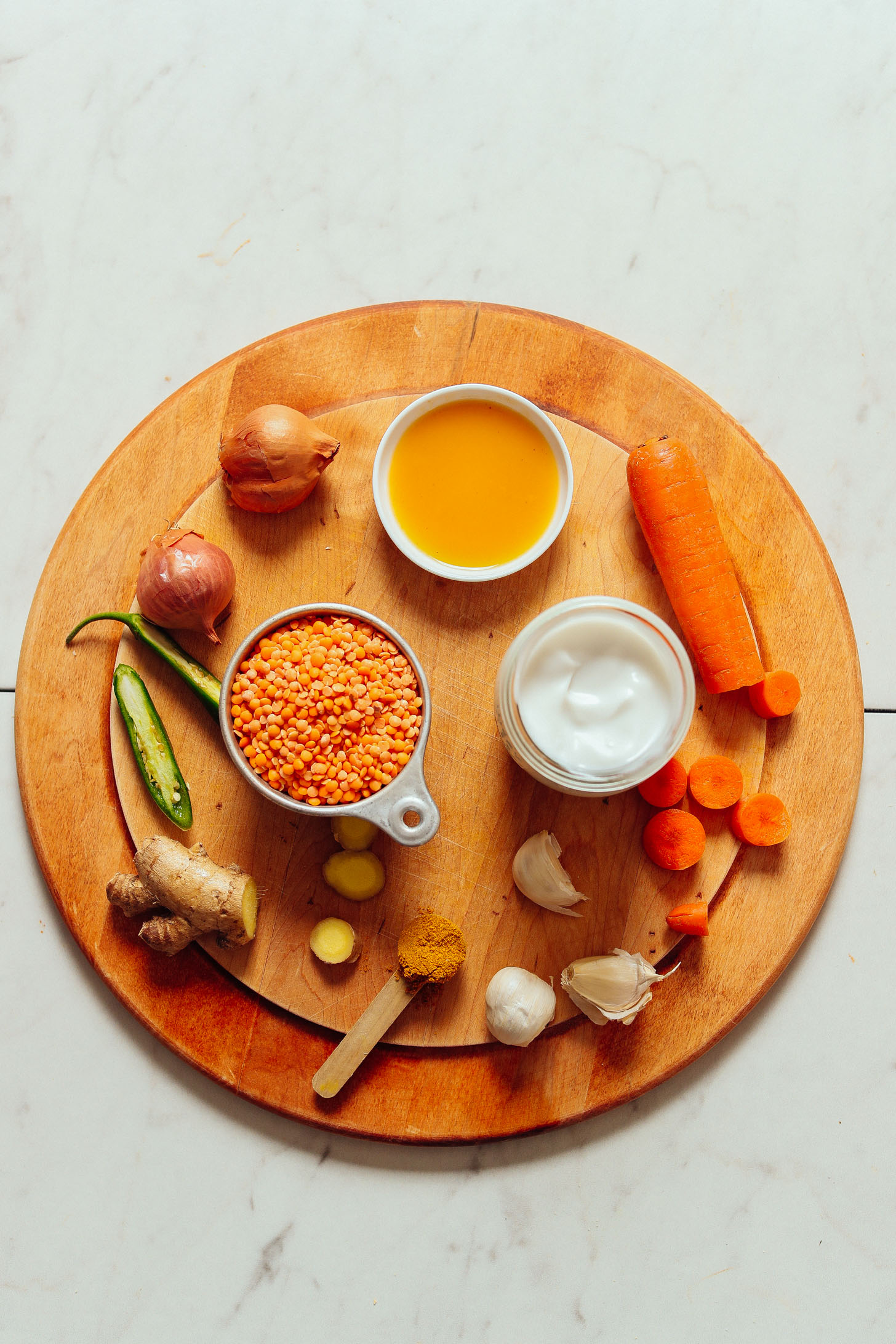 An overhead angle of the spices, vegetables, and ingredients required for golden curry lentil soup