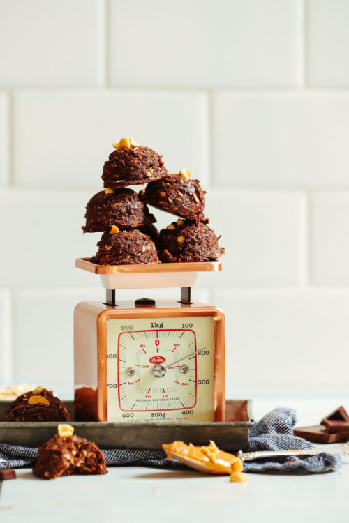 Stack of Vegan Peanut Butter No-Bake Cookies on a vintage scale
