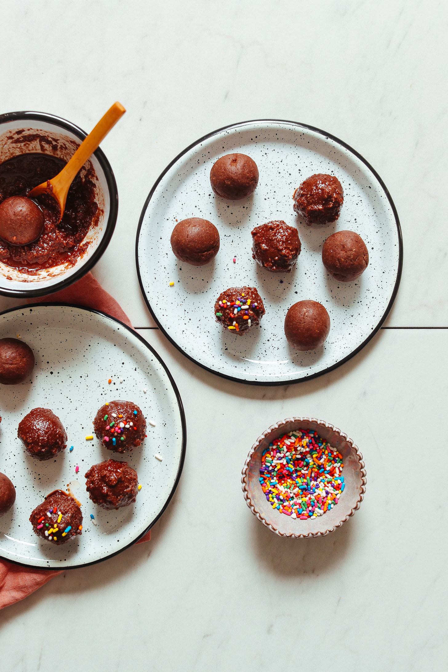Plates of freshly made gluten-free vegan Chocolate Cake Bites