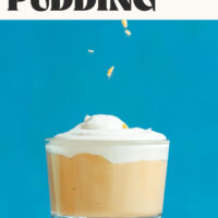 Sprinkling chopped peanuts into a jar of vegan peanut butter pudding