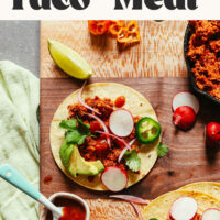 Wood cutting board of tacos made with raw walnut taco meat