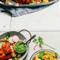 Tray and plates of our delicious Whole Roasted Cauliflower recipe with quinoa and chimichurri