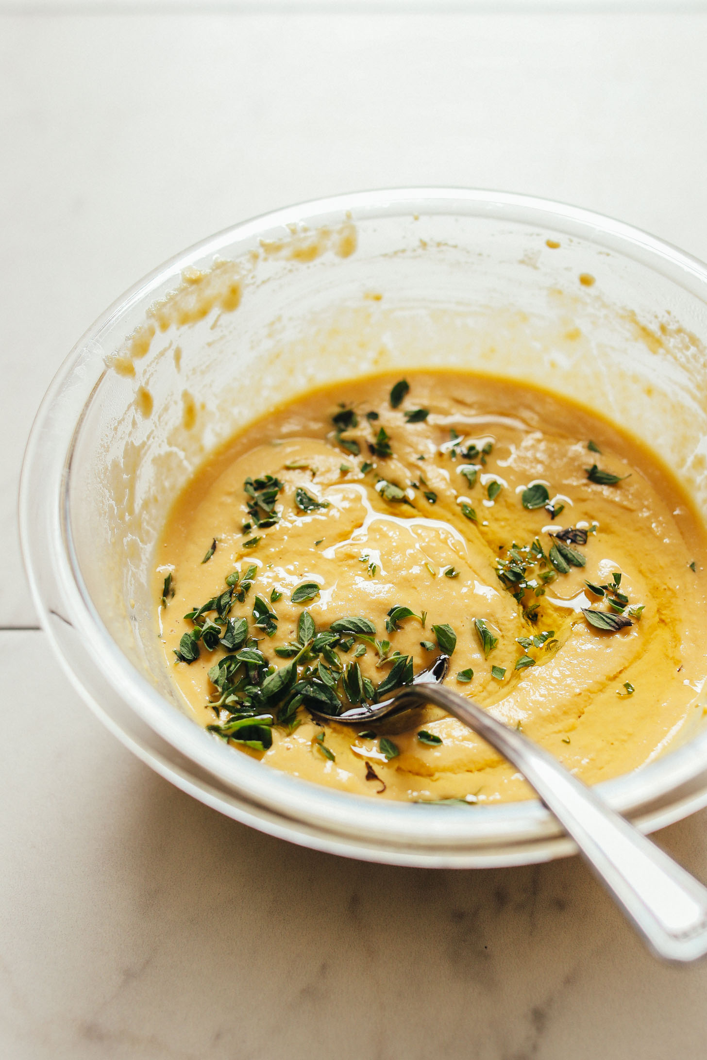 Stirring the batter for gluten-free vegan Socca Pizza
