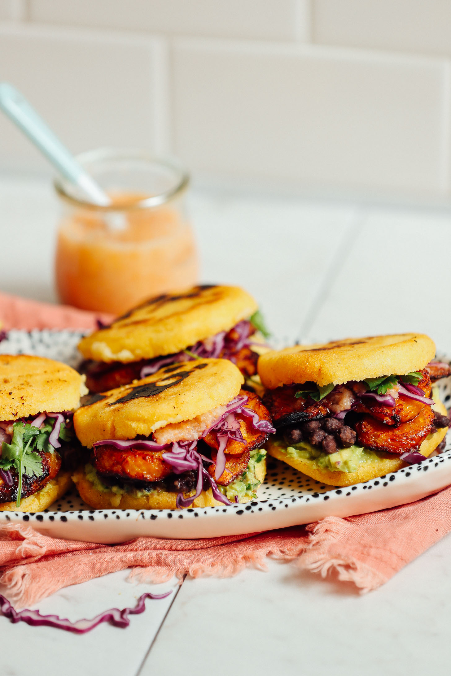 Platter filled with gluten-free Vegan Arepa Sandwiches