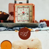 Vintage scale and piece of parchment paper with squares of Chocolate Peanut Butter Freezer Fudge