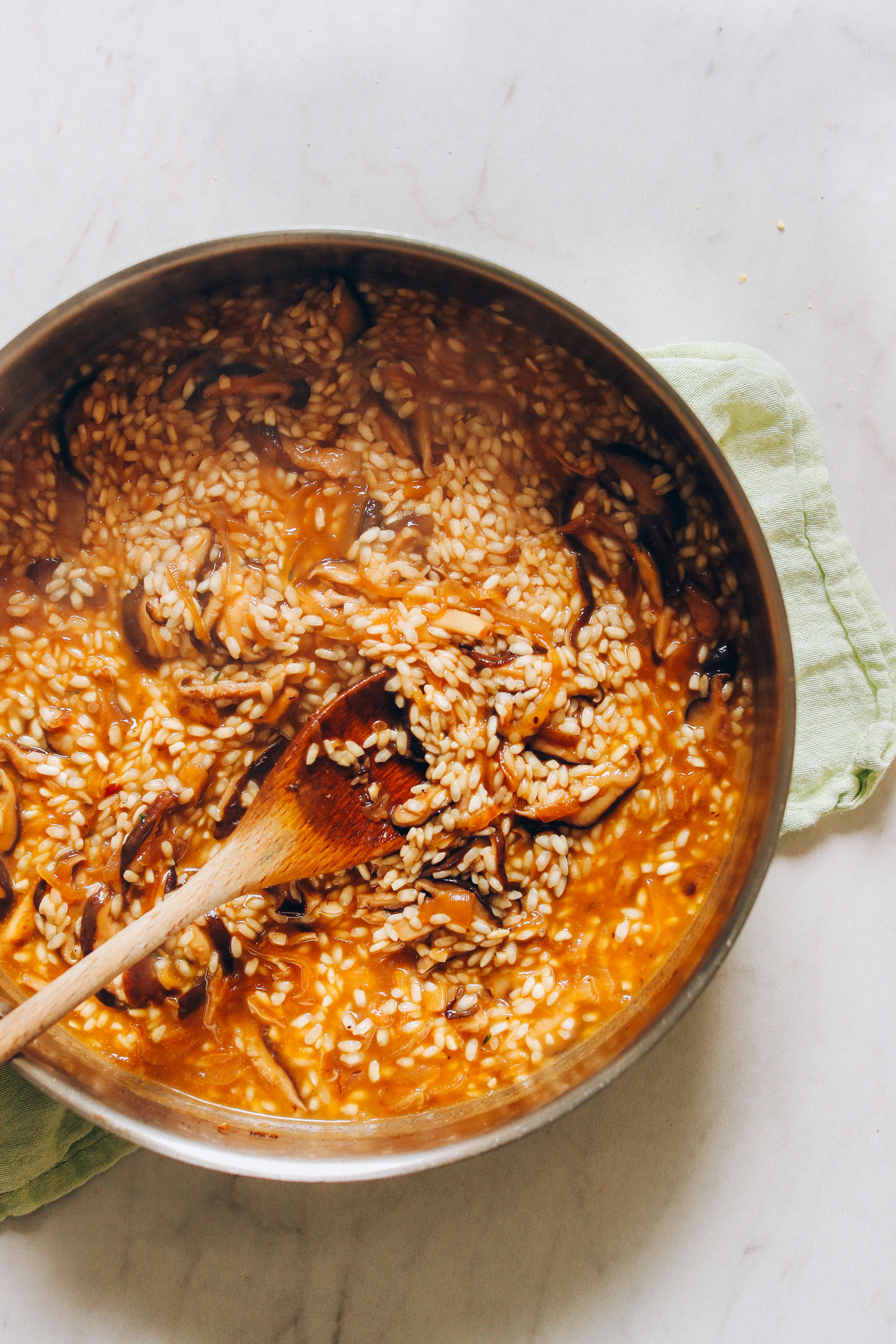 Stirring a batch of our Vegan Caramelized Shiitake Mushroom Risotto recipe