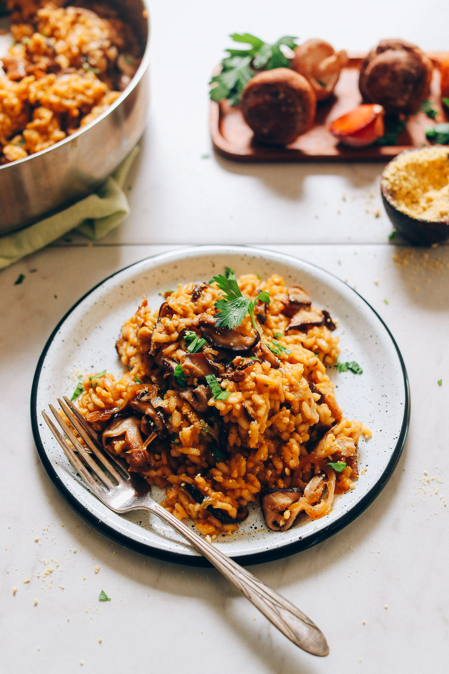 Plate of delicious Vegan Caramelized Shitake Mushroom Risotto topped with fresh parsley