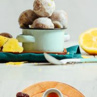 Bowl of our Lemon Poppy Seed Donut Holes and cutting board with ingredients to make them