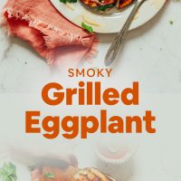 Plate and cutting board filled with our Smoky Grilled Eggplant drizzled with tahini