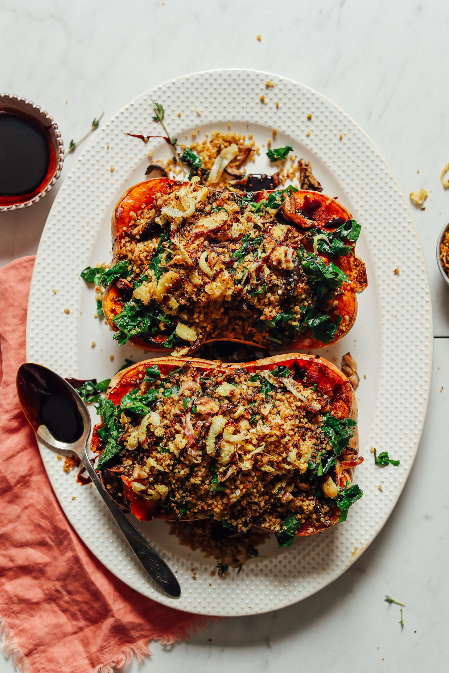 White platter with Stuffed Butternut Squash for a vegan Thanksgiving dish