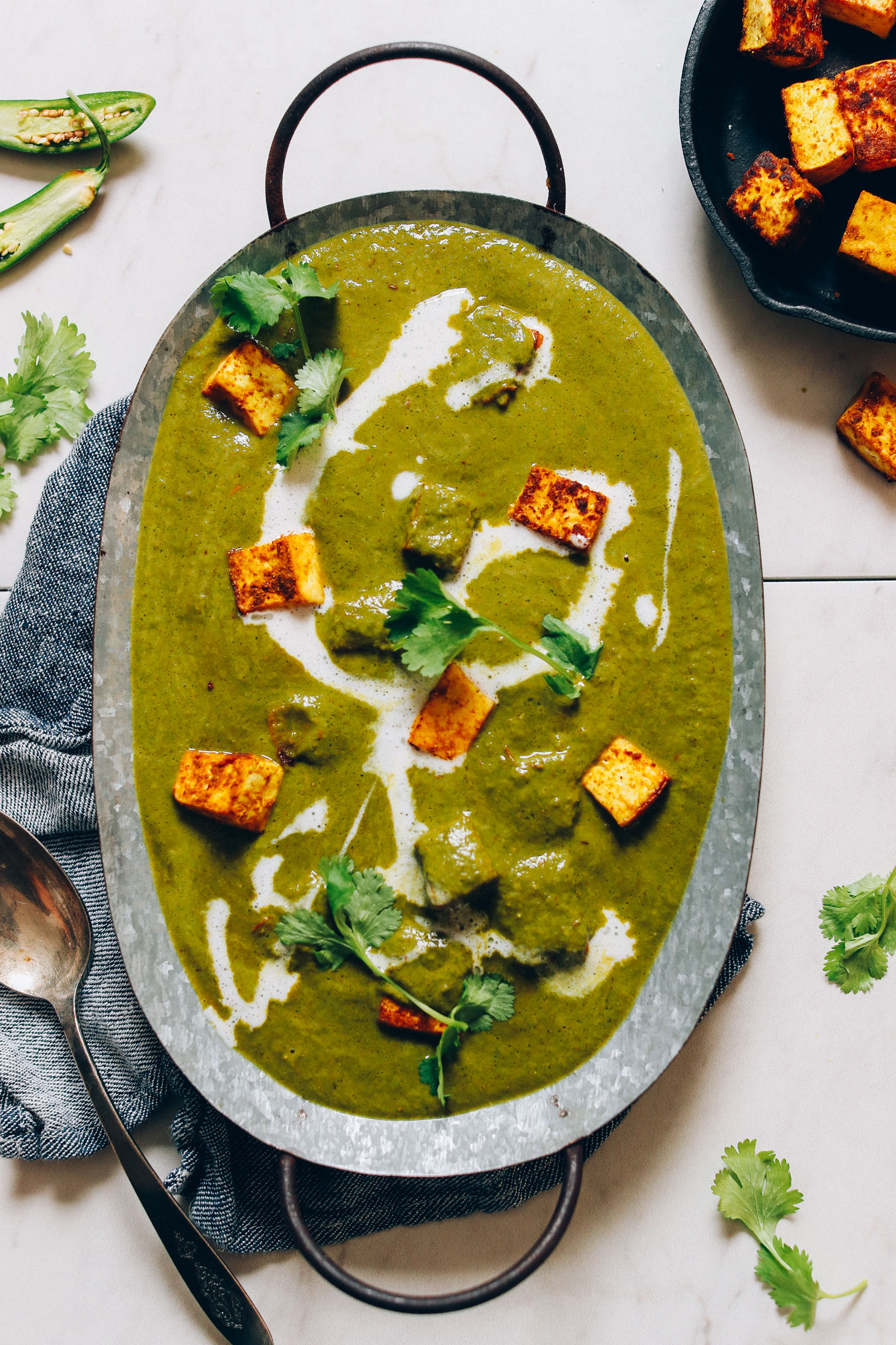 Metal tray filled with a batch of Vegan Tofu Palak Paneer