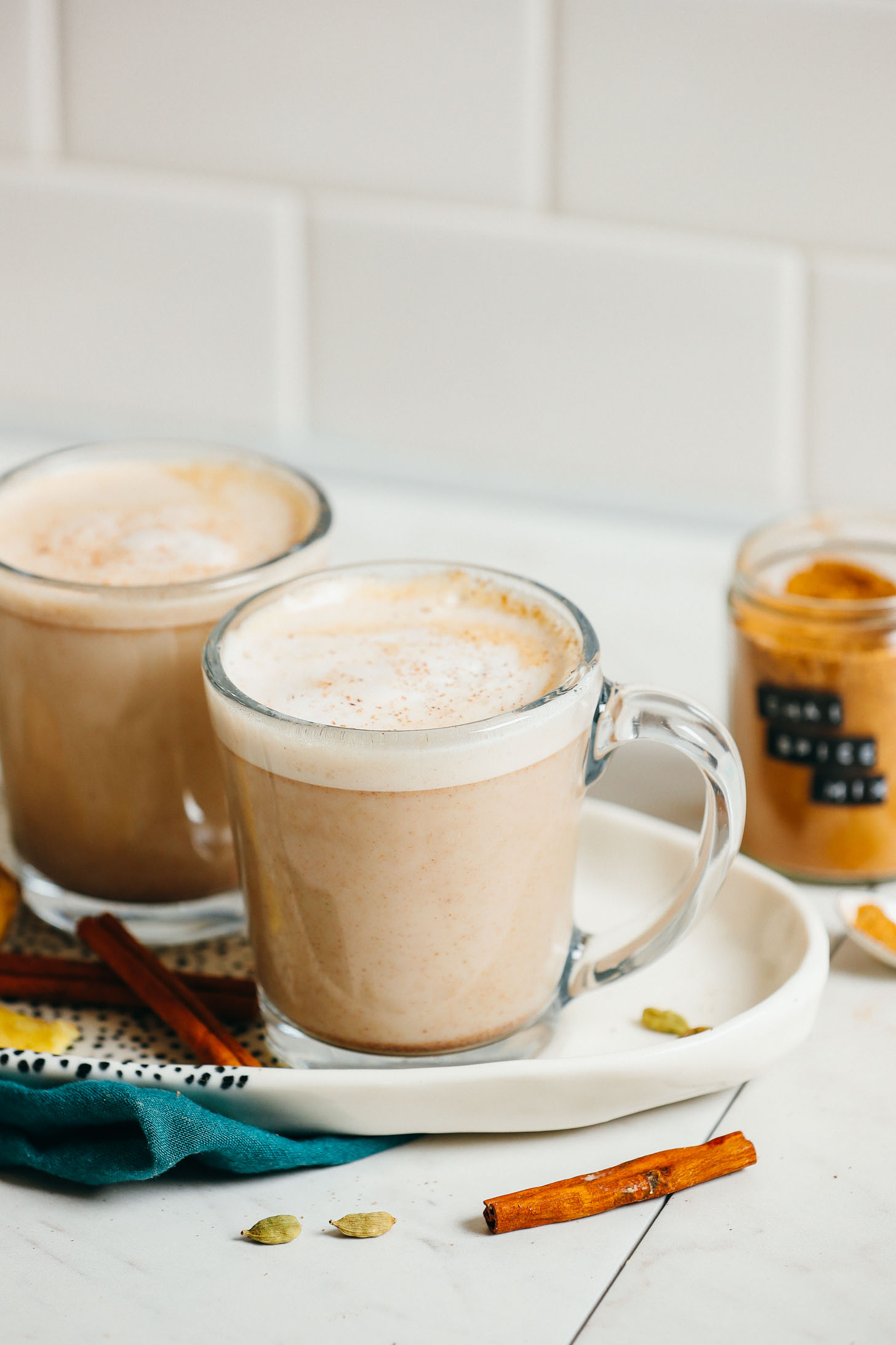 Two vegan chai lattes made with our DIY chai spice mix recipe
