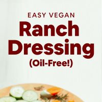 Cutting board with fresh vegetables and bowl of our Easy Vegan Ranch Dressing recipe