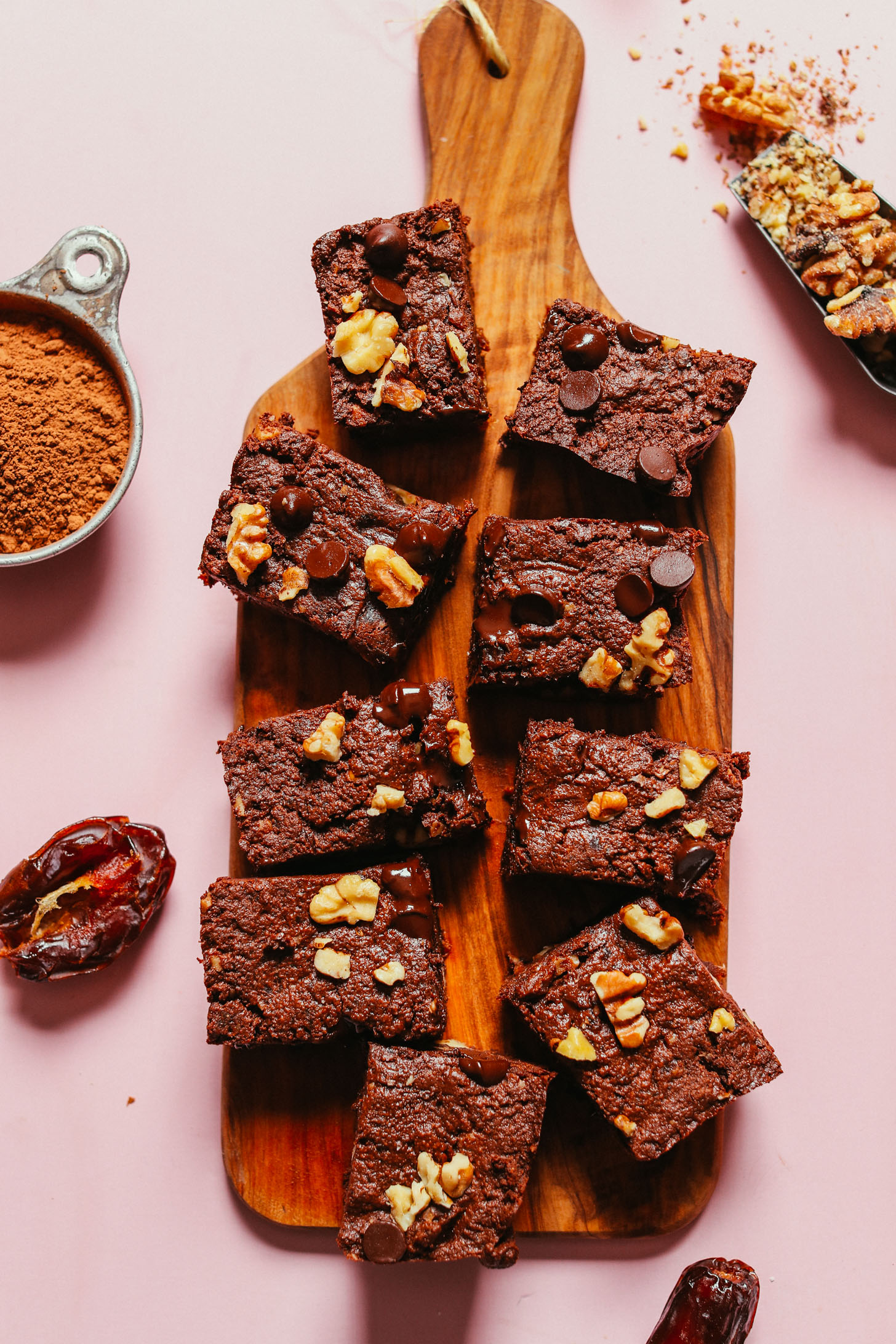 Wood cutting board with a batch of our easy vegan brownies recipe