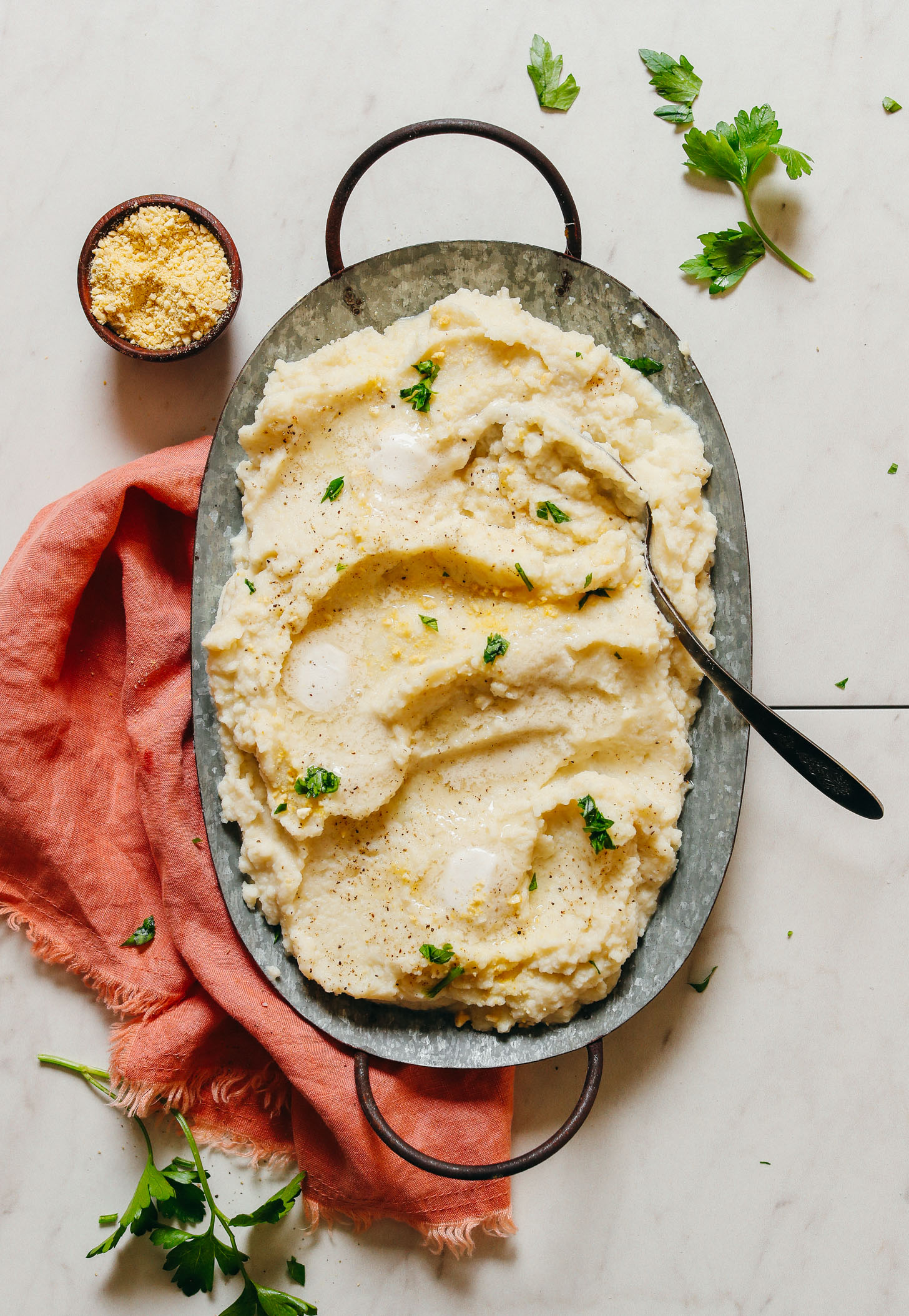 Tray of creamy Garlic Mashed Cauiflower for a vegan Thanksgiving side dish
