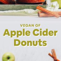 Cooling rack and tray filled with homemade Gluten-Free Vegan Apple Cider Donuts