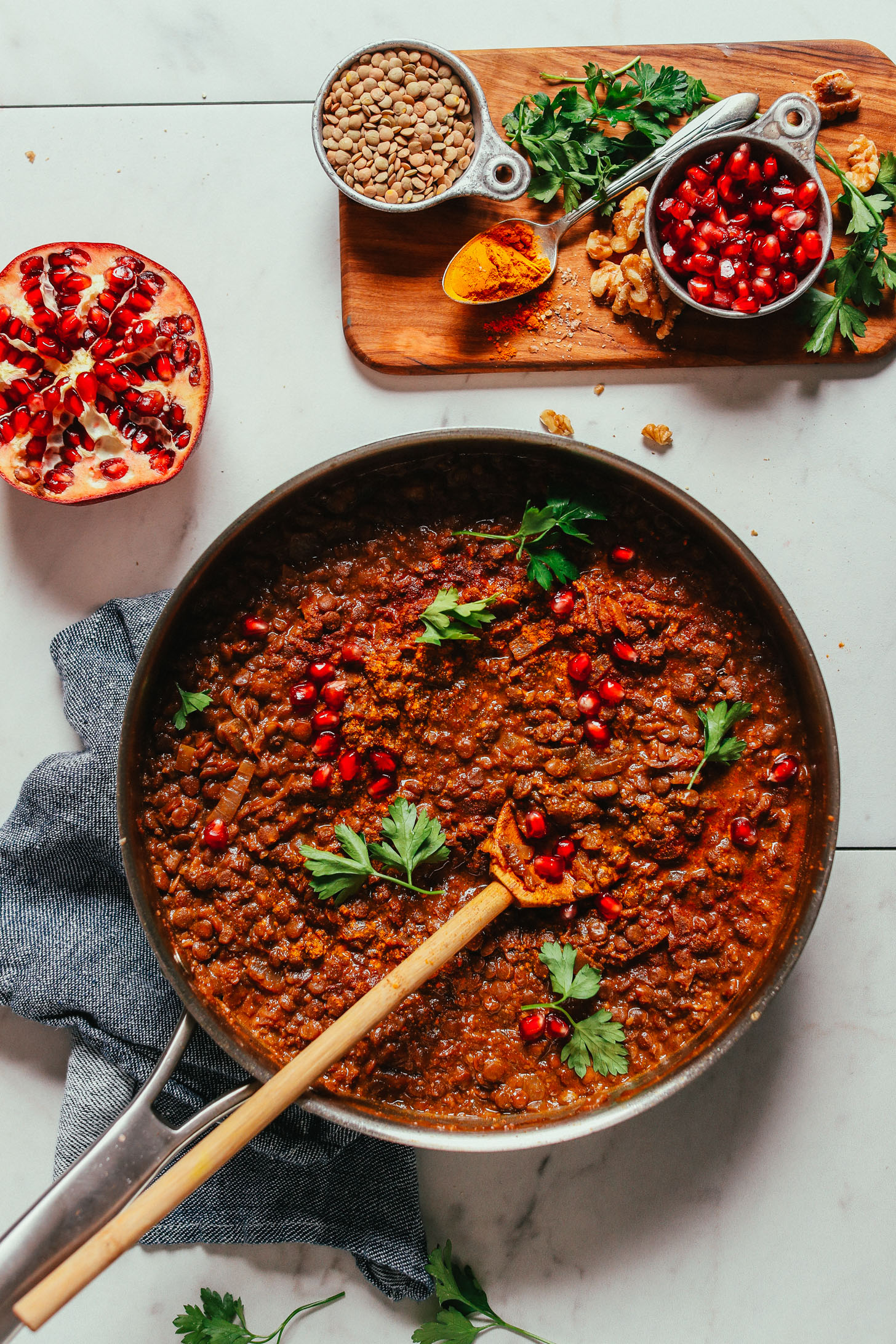 Large skillet filled with a batch of our hearty vegan Lentil Fesenjan recipe