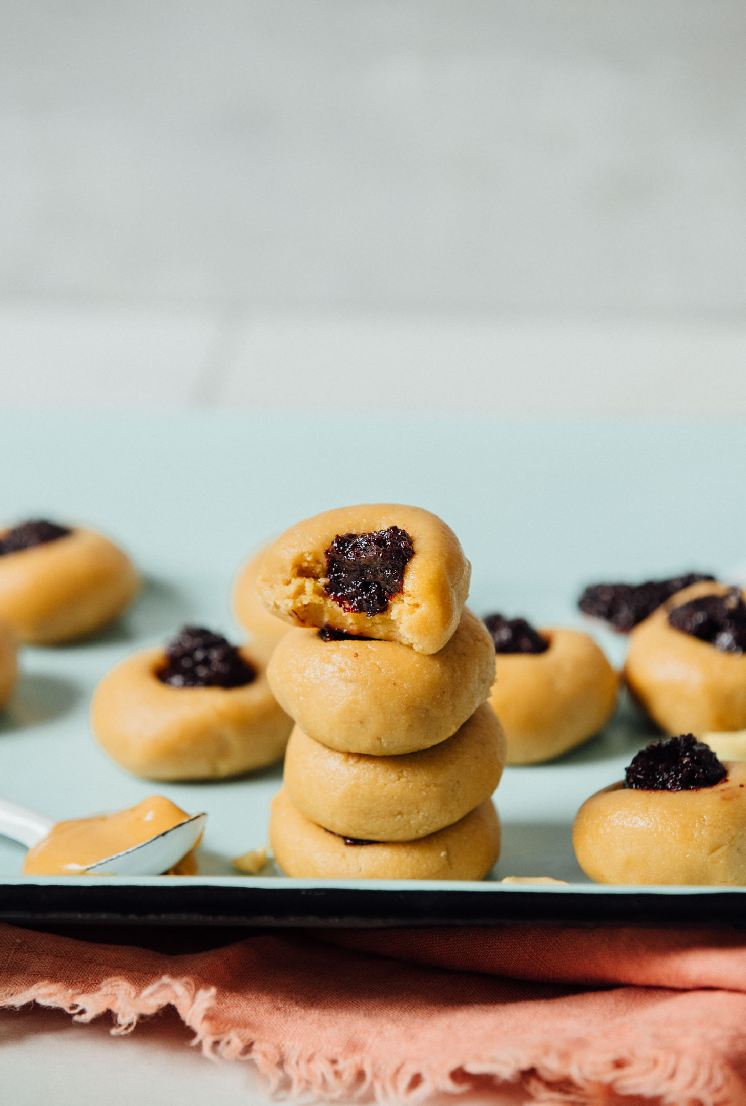 Stack of gluten-free No-Bake Peanut Butter Thumbprint Cookies