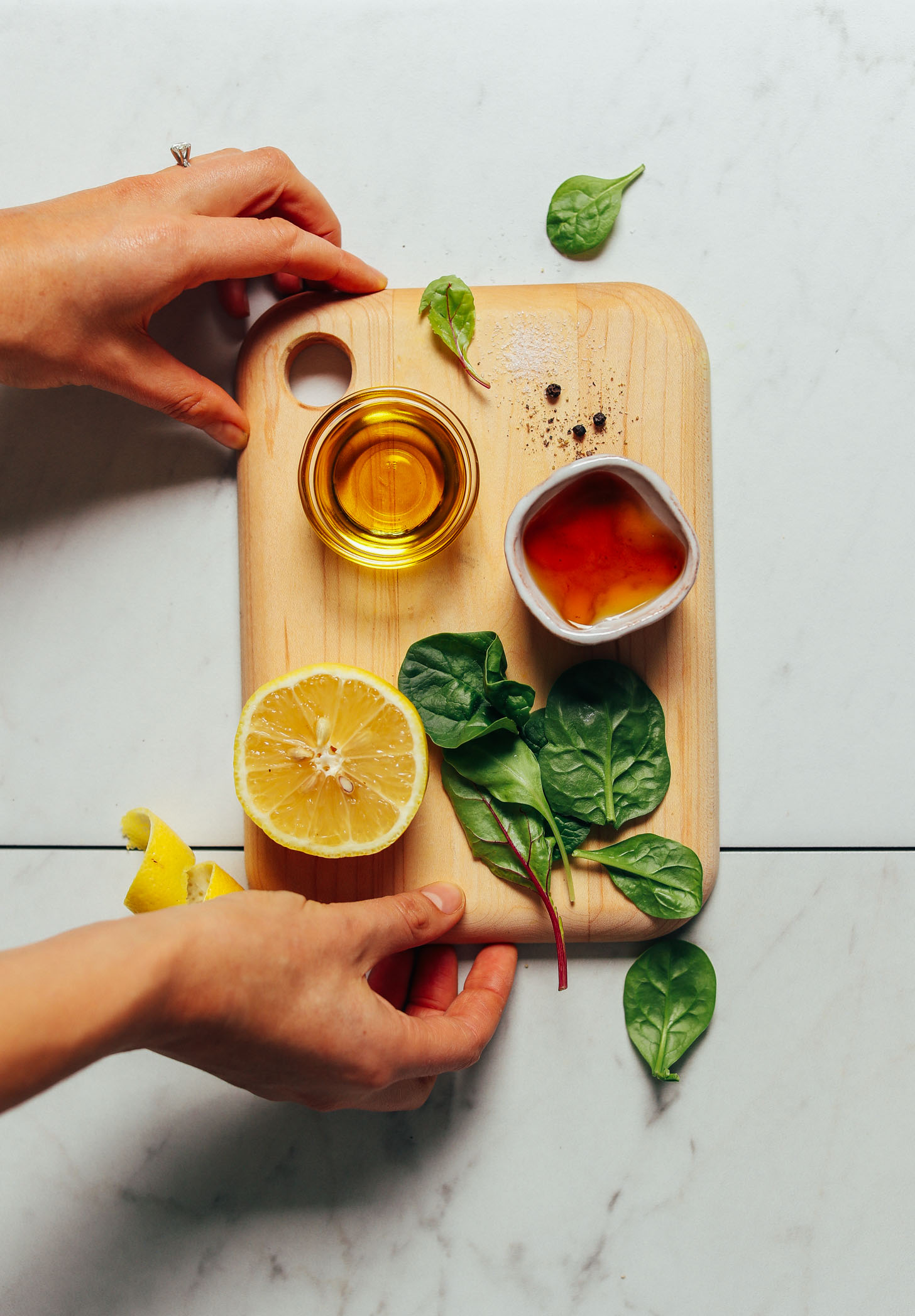 Cutting board with ingredients for making homemade Lemon Vinaigrette