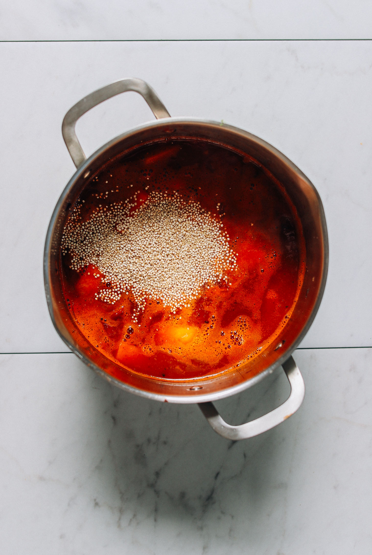 Quinoa floating on the top of a pot of our Butternut Squash Chili recipe