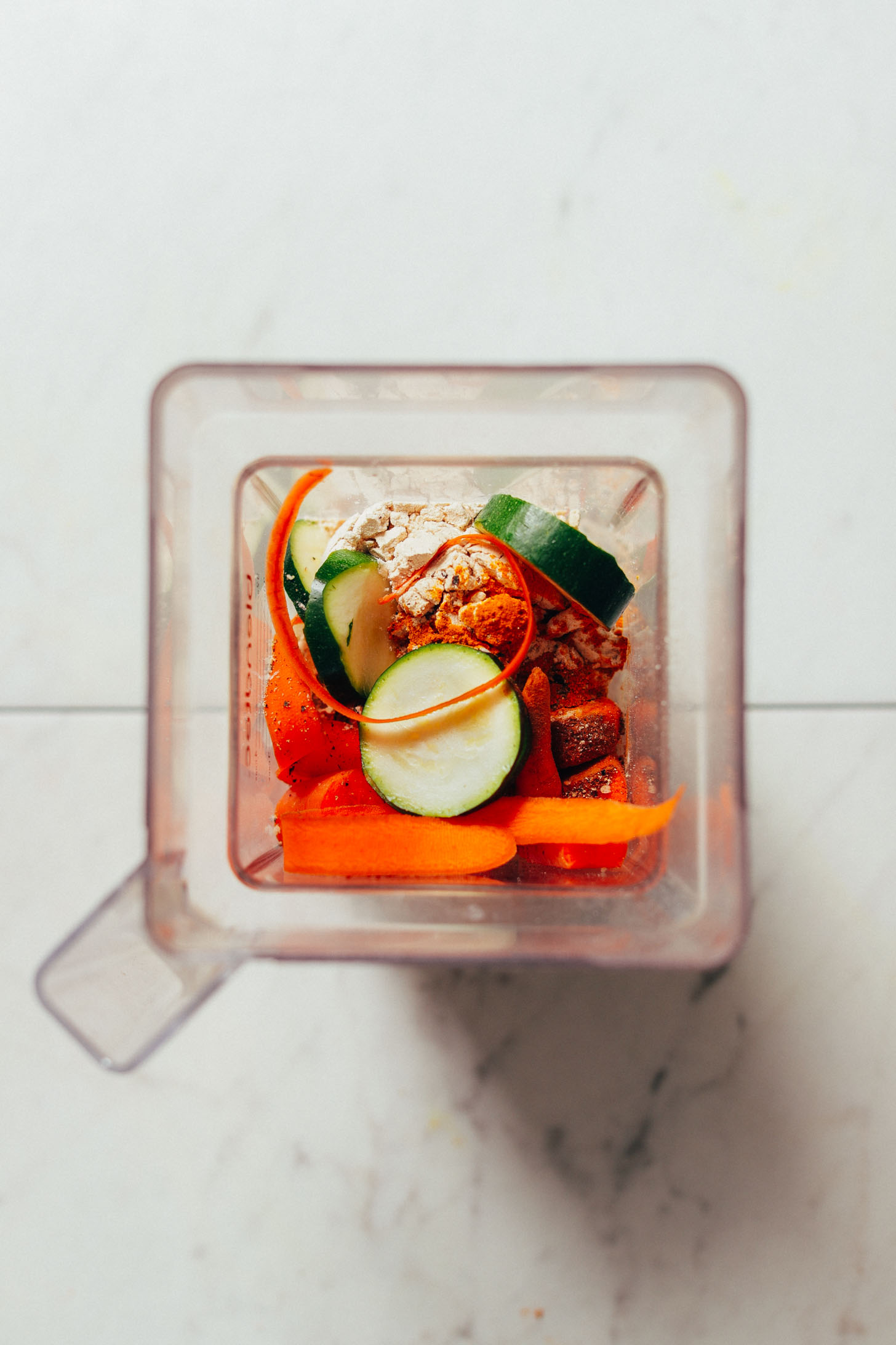 Overhead image of warming winter smoothie ingredients in blender