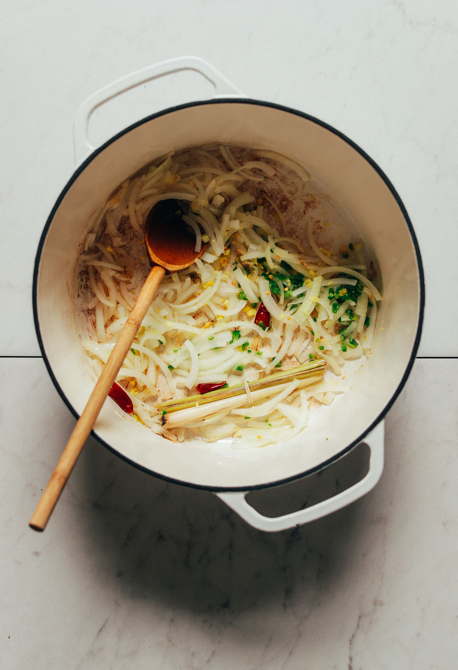 Sautéing onion and other ingredients for our Lazy 1-Pot Vegan Tom Yum Soup recipe