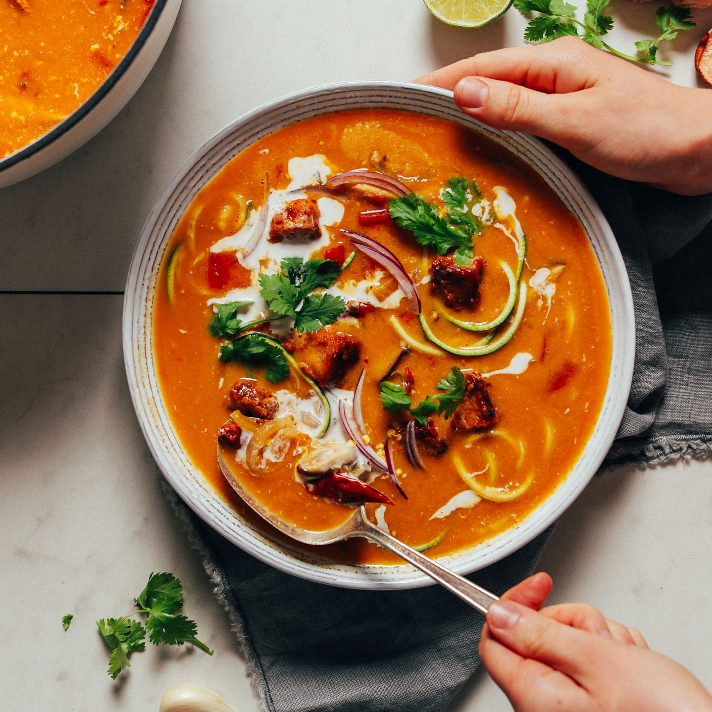 Grabbing a spoonful of Vegan Tom Yum