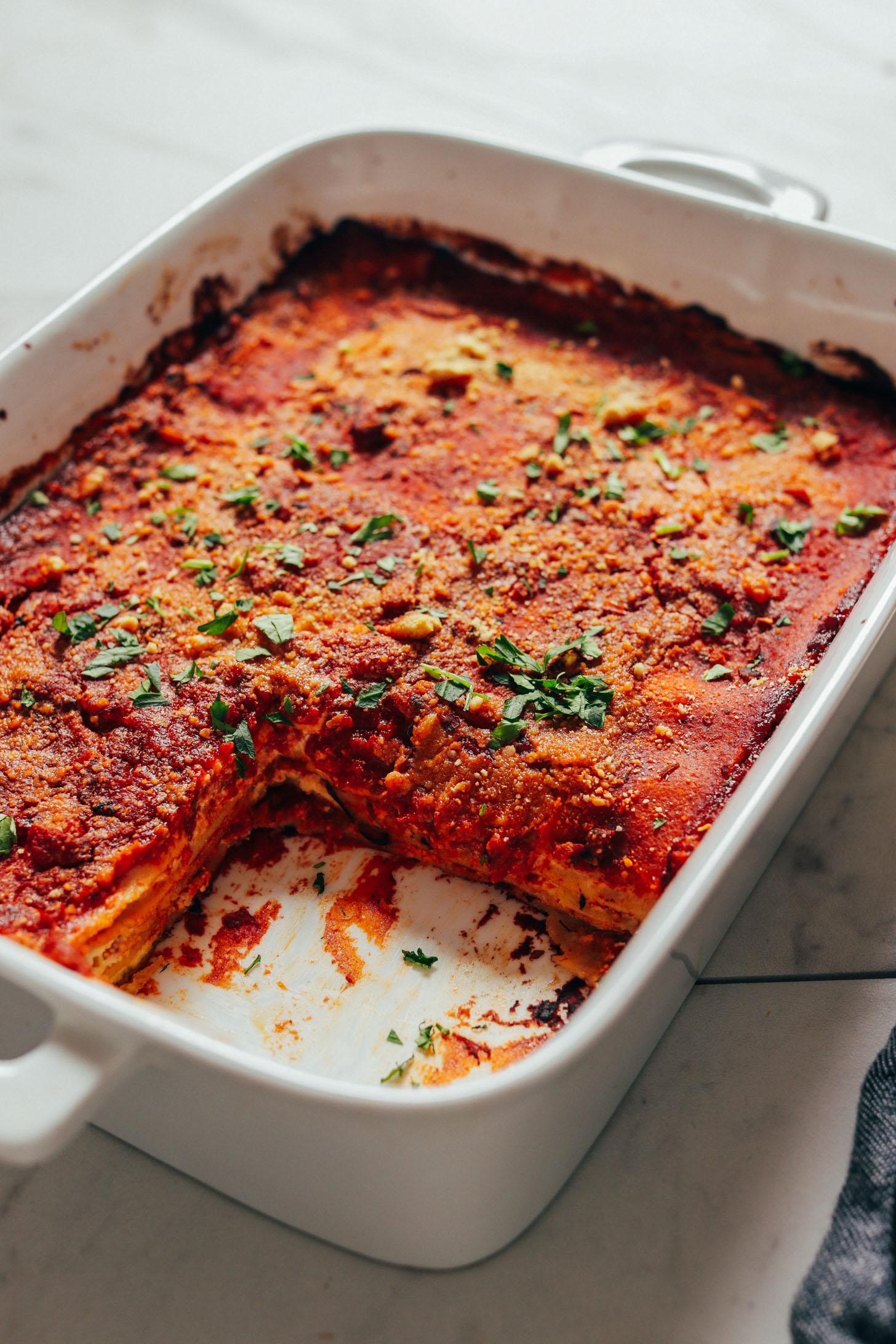 Pan of Easy Vegan Lasagna with a serving removed