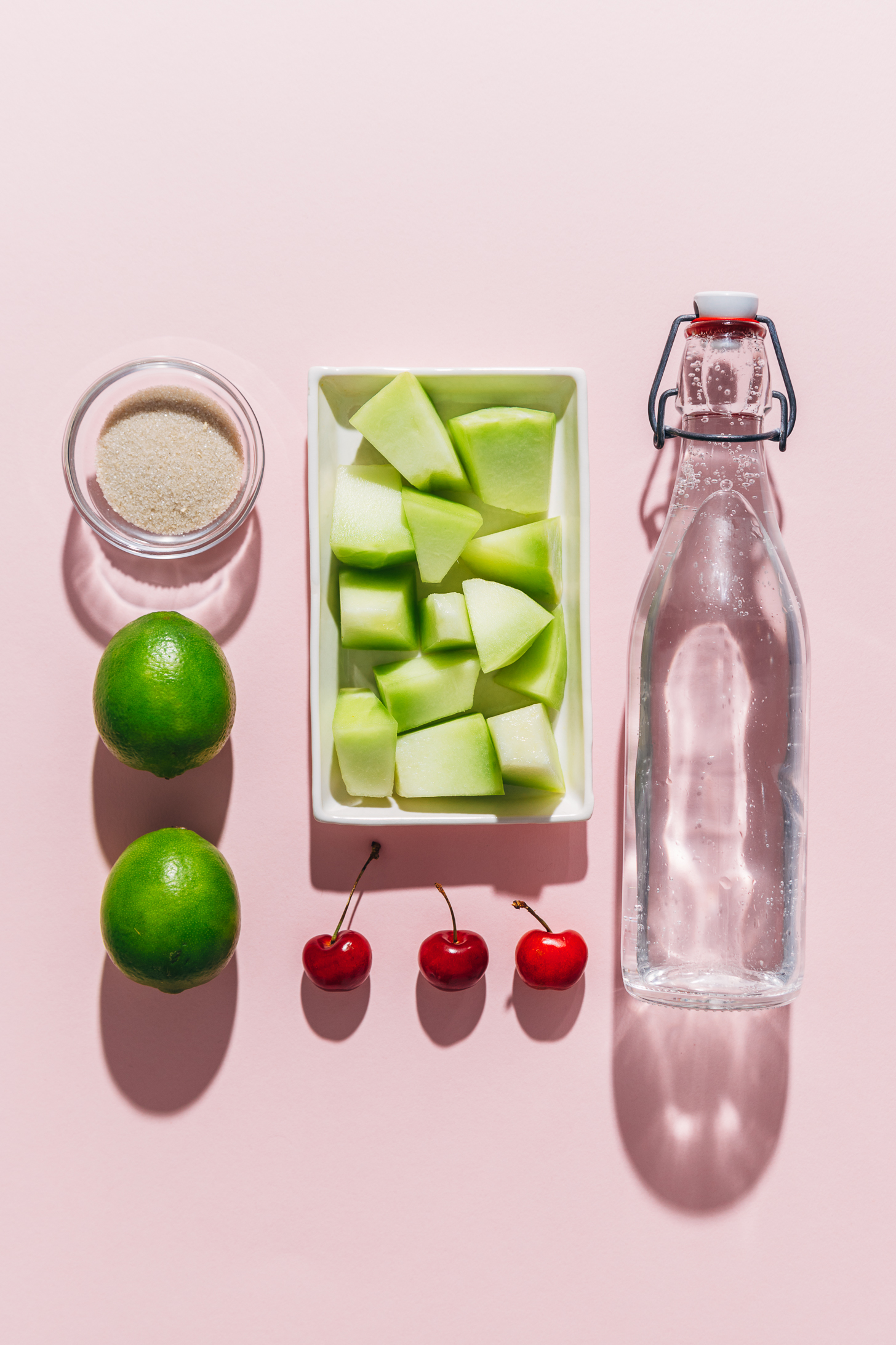 Melon, cherries, lime, and other ingredients for making our virgin Citrus and Melon Spritzer recipe