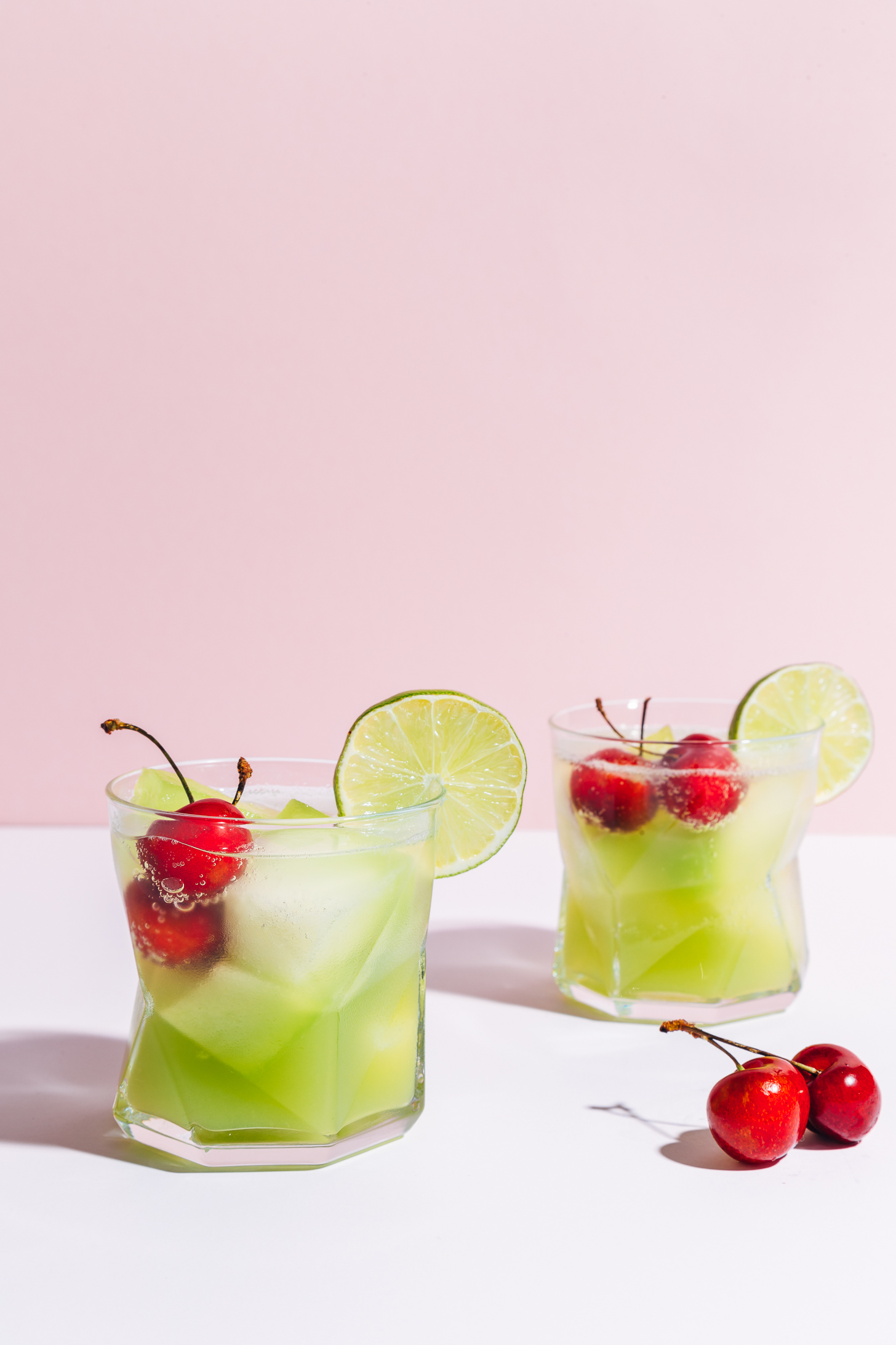 Two glasses of our Citrus and Melon Spritzer recipe for a refreshing alcohol-free summer drink
