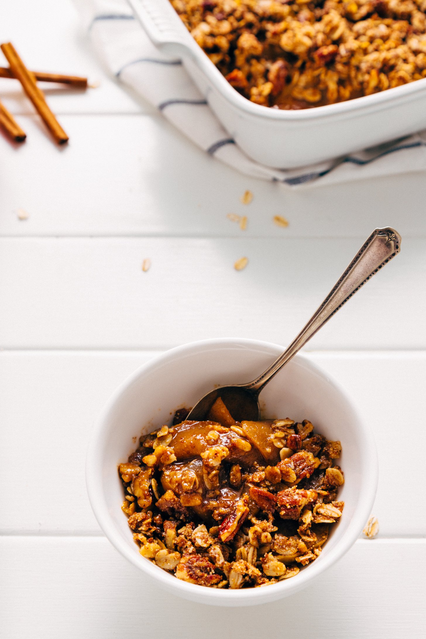 Spoon resting in a bowl of delicious gluten-free vegan Apple Crisp