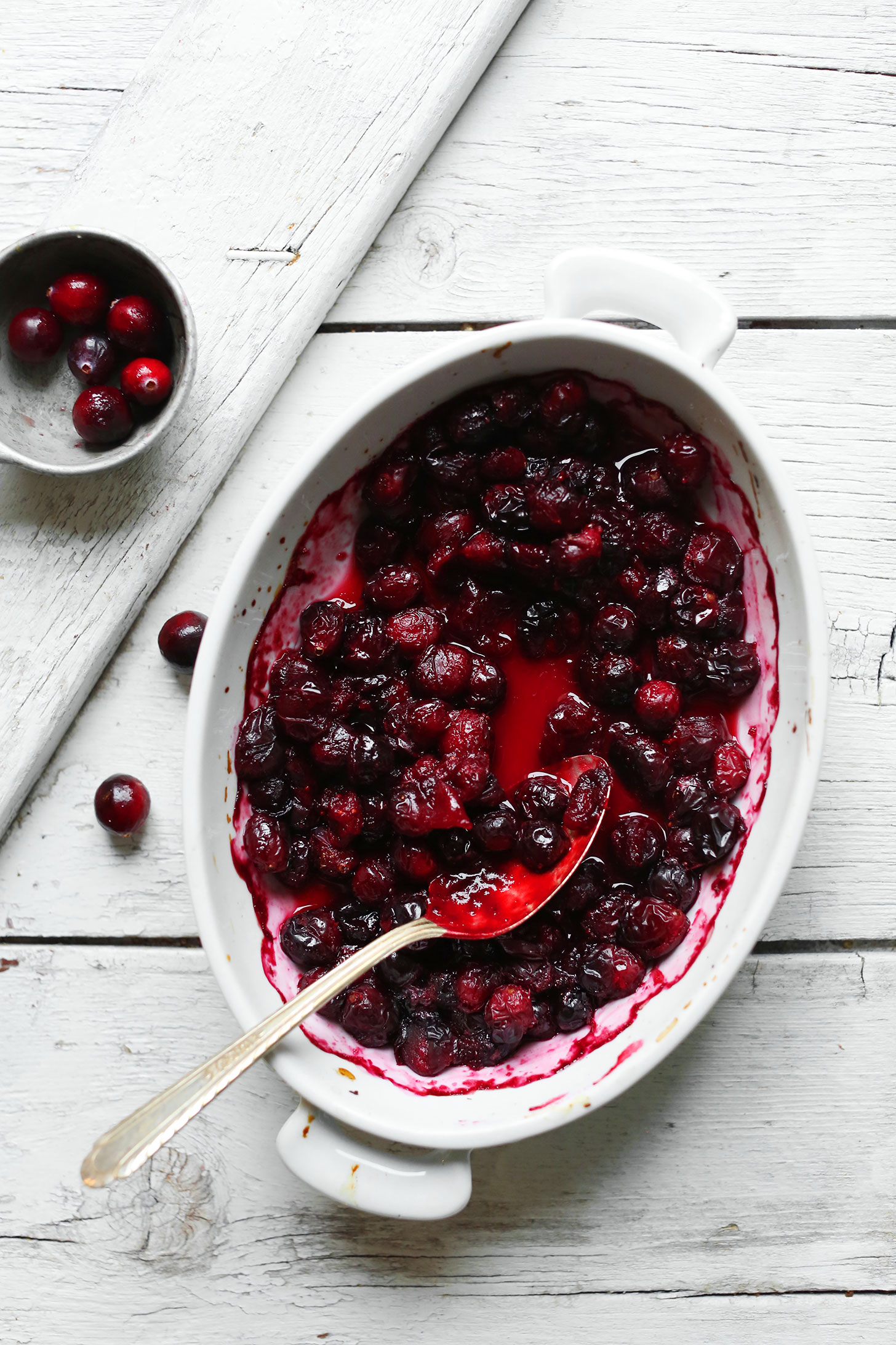 Baking dish of freshly made cranberry compote for adding to oatmeal