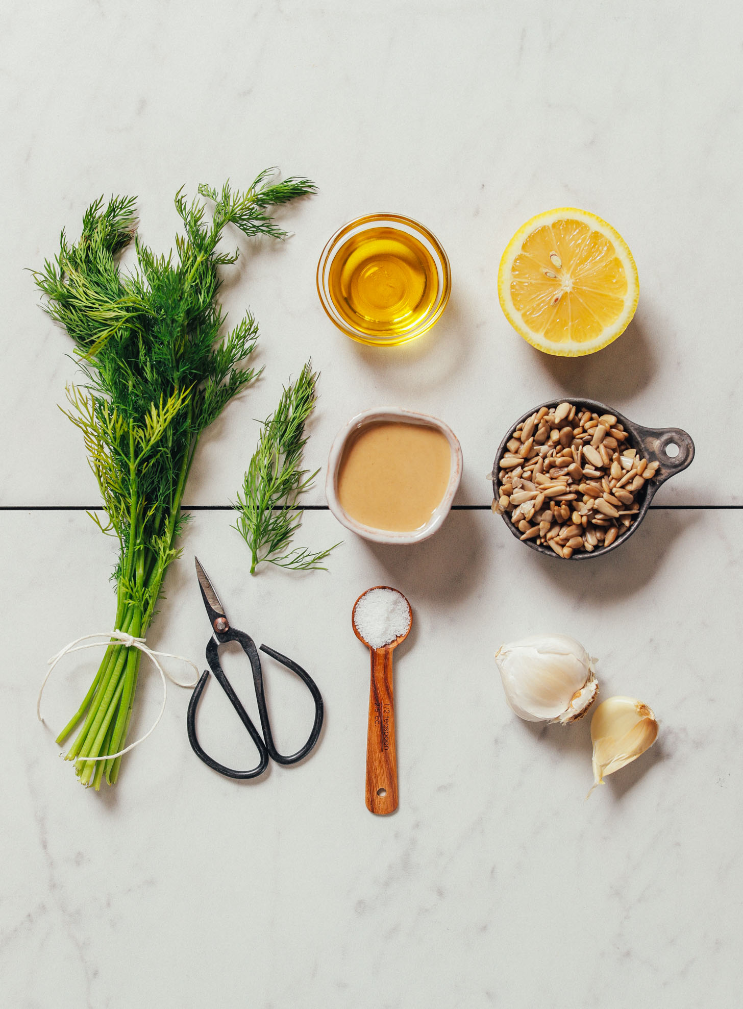 Assortment of ingredients for making bean-free Garlic Dill Sunflower Dip