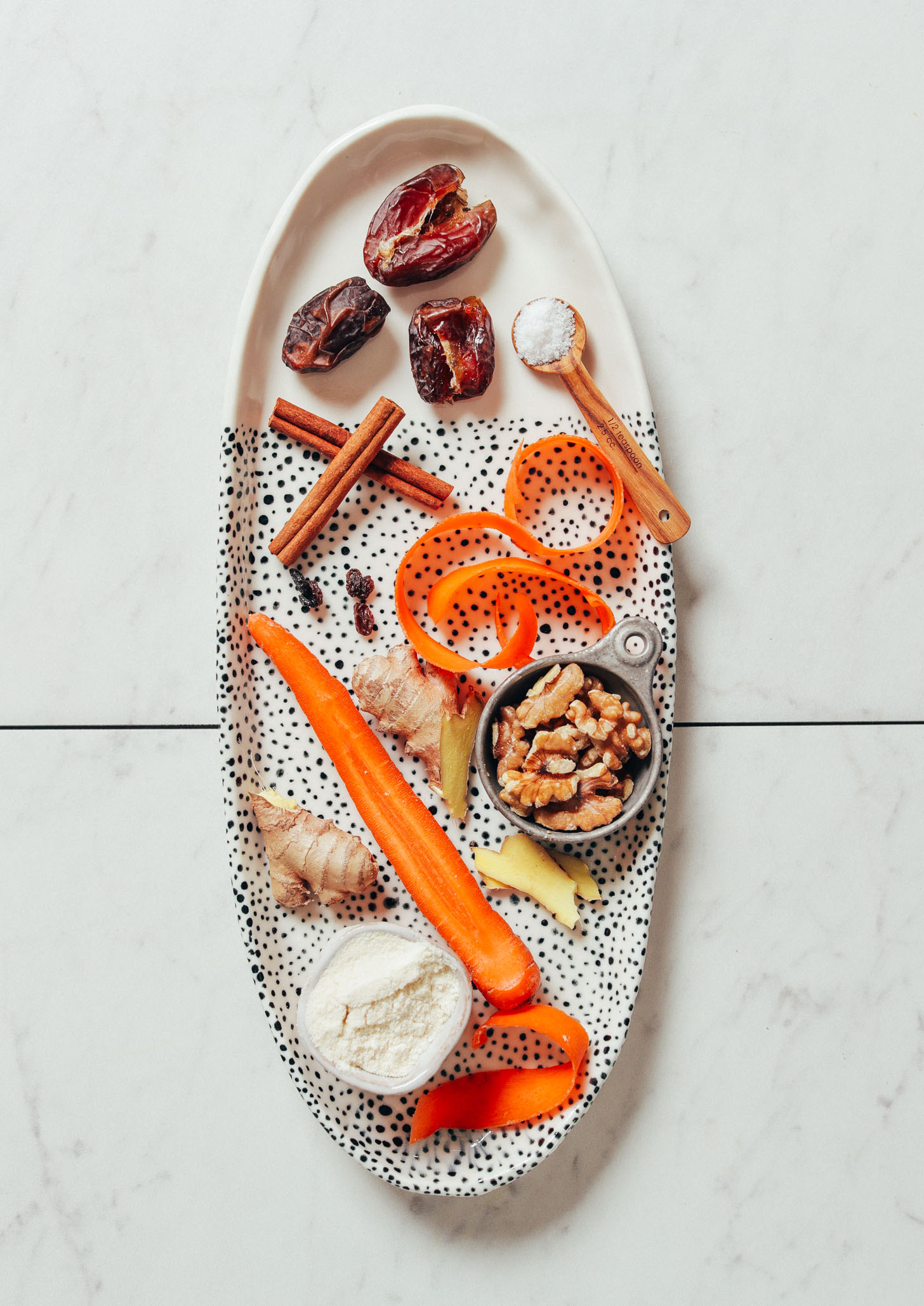 Tray of ingredients for making our grain-free Raw Carrot Cake Bites recipe