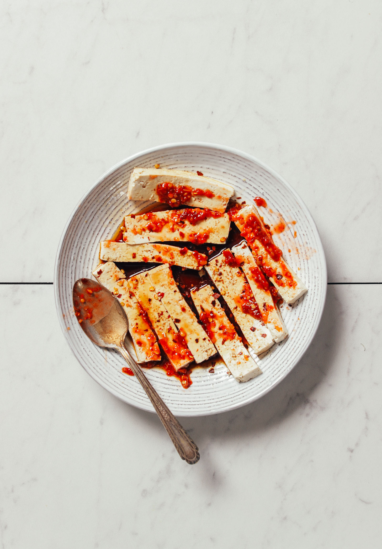 Bowl of marinated tofu for making Crispy Shallot Spring Rolls