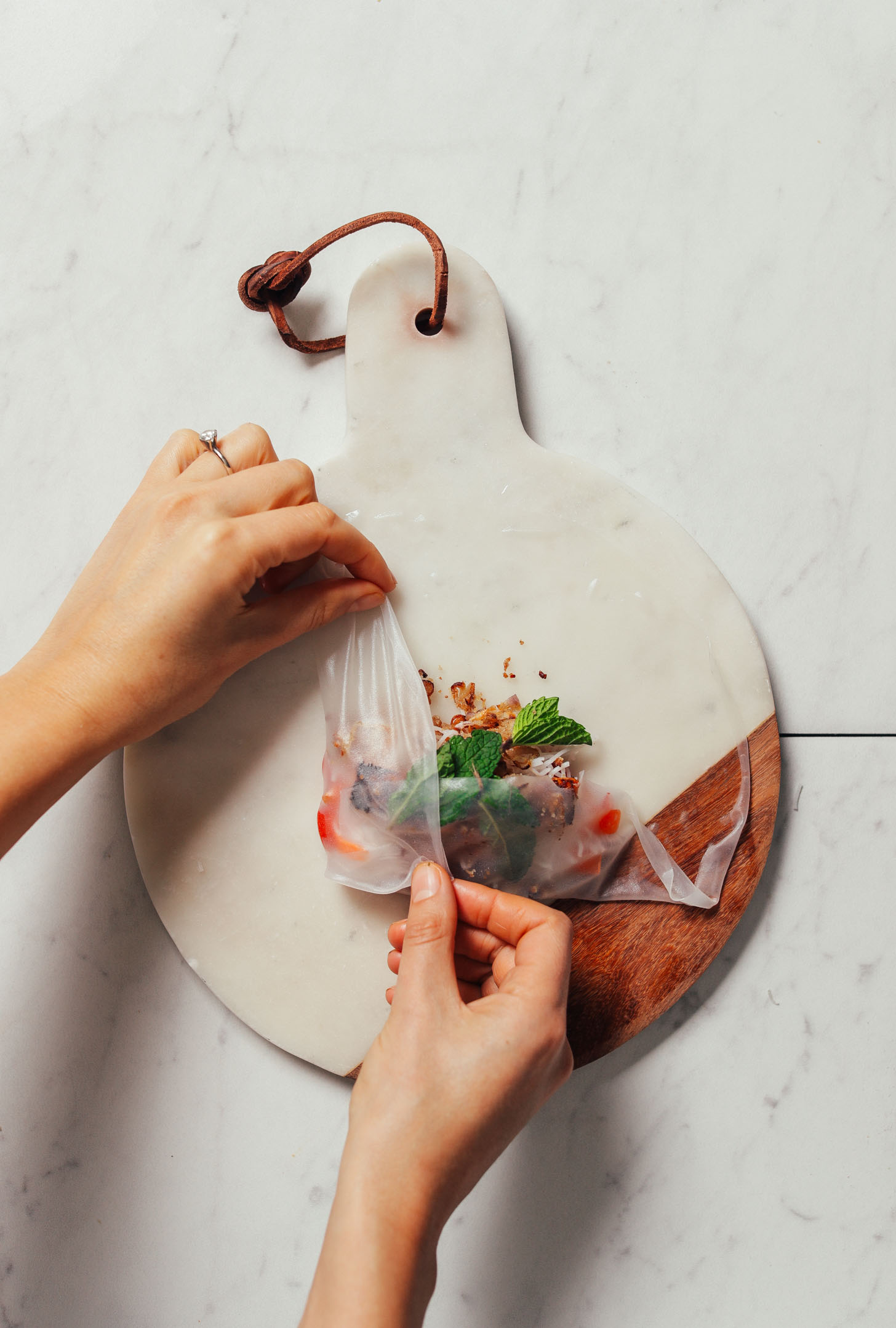 Showing how to assemble a delicious Crispy Shallot Spring Roll made with Seared Tofu