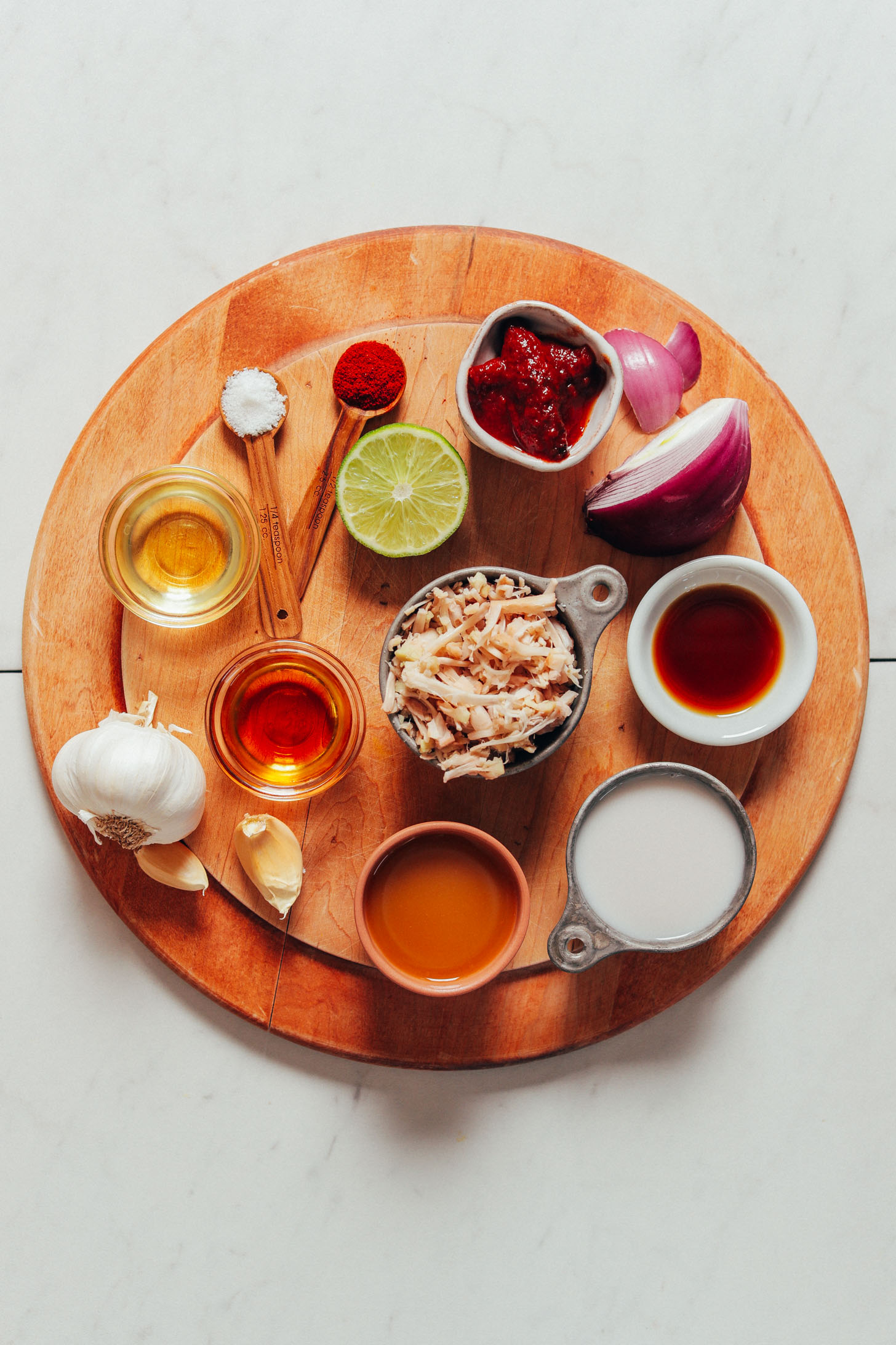 Wood cutting board with ingredients for making our Smoky Marinated Jackfruit recipe