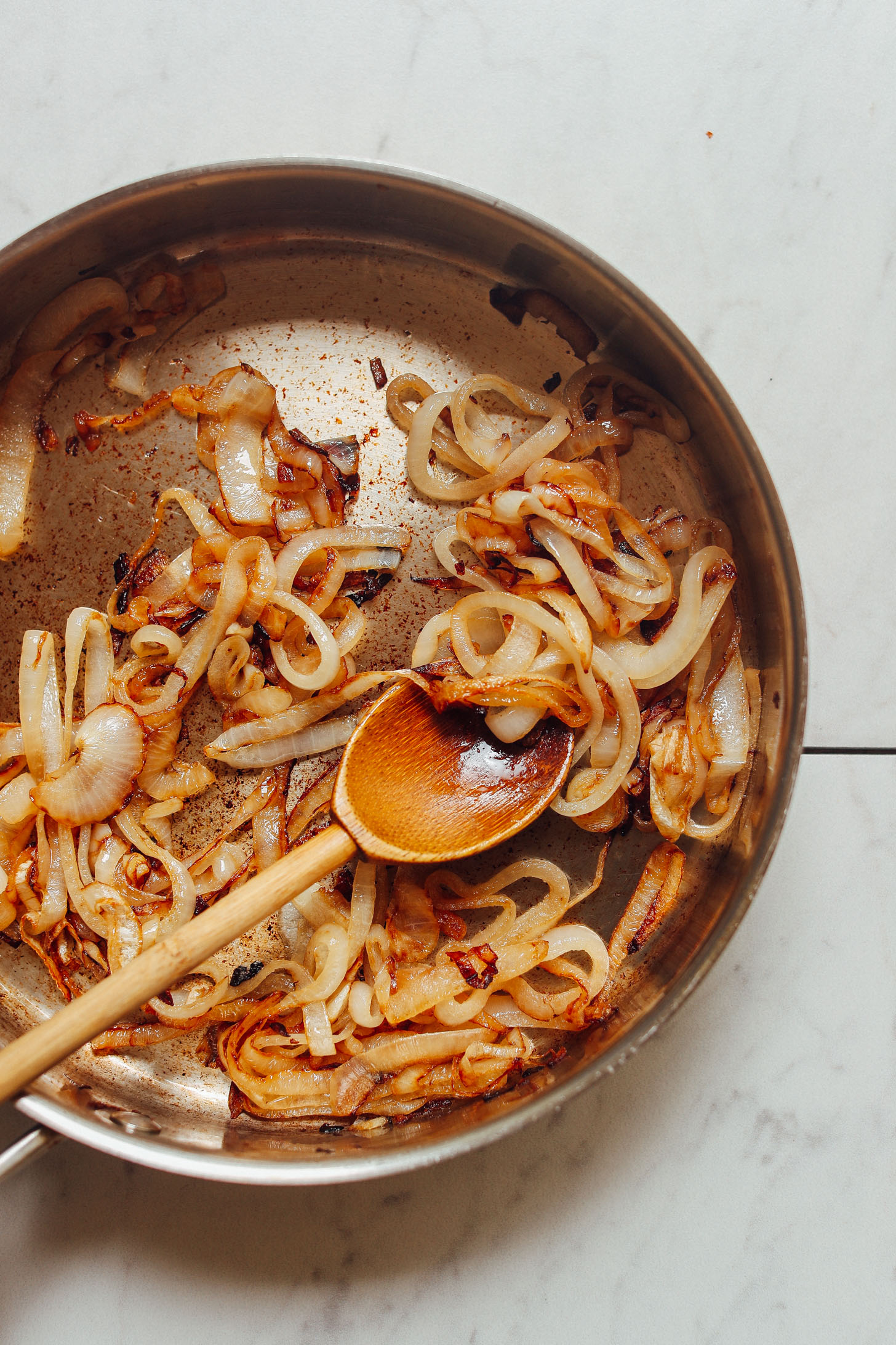 Skillet of caramelized onions for topping our Portobello Burgers recipe