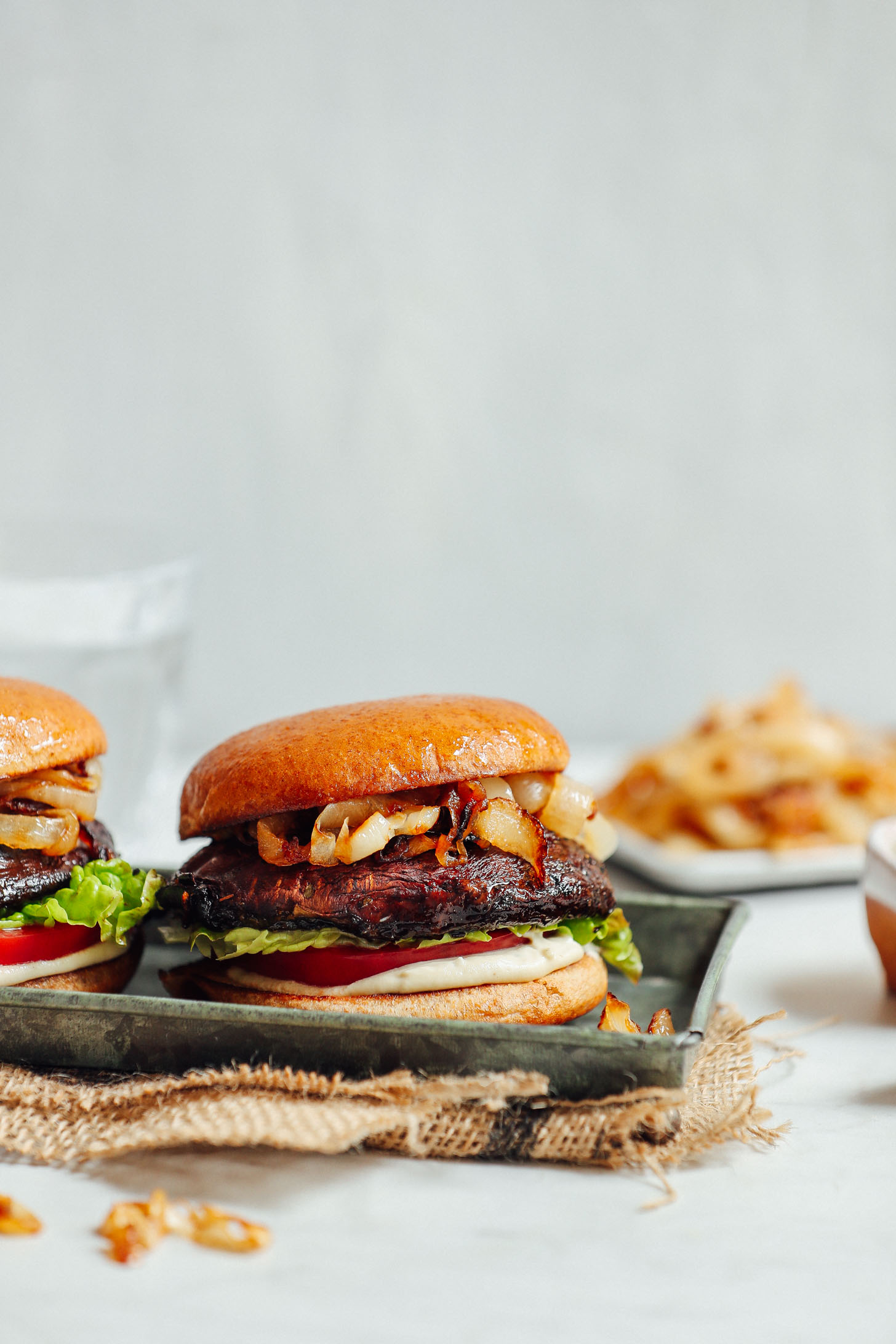 Tray of Balsamic Marinated Portobello Burgers with Caramelized Onions and Garlic Aioli
