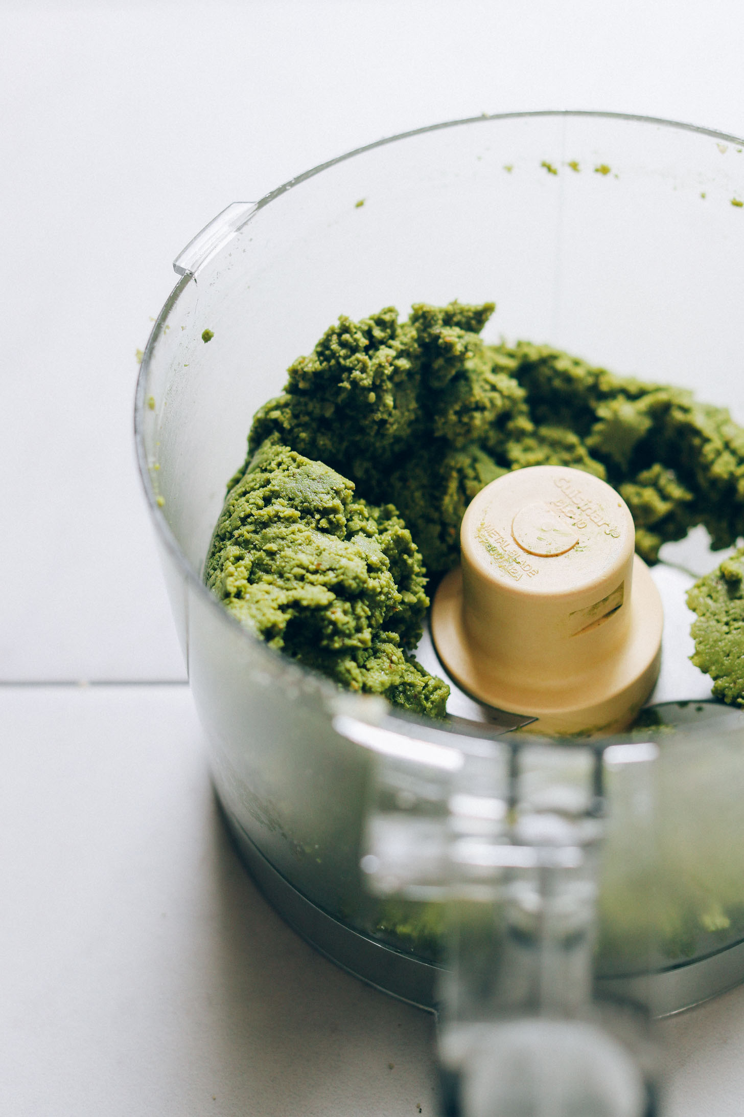 Food processor with dough for making plant-based Matcha Bliss Balls