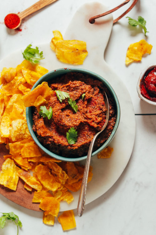 Plate of plantain chips and a bowl of Smoky Refried Lentils