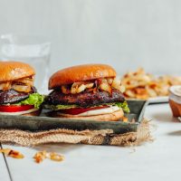 Tray of Balsamic Marinated Portobello Burgers topped with Caramelized Onions and Garlic Aioli