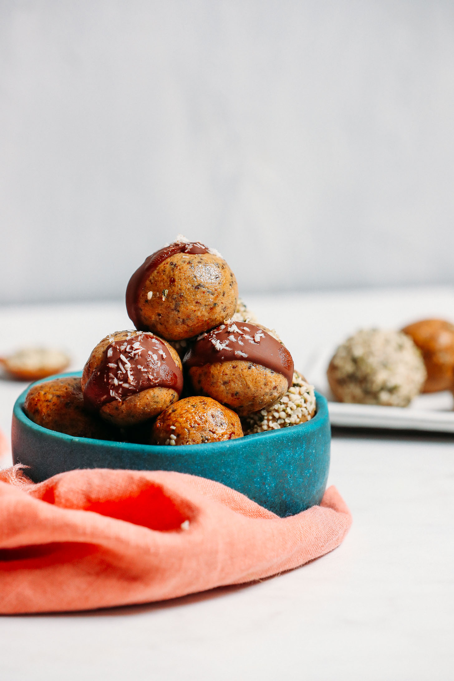 Bowl piled high with our grain-free, low sugar Protein Balls made with 5 simple ingredients