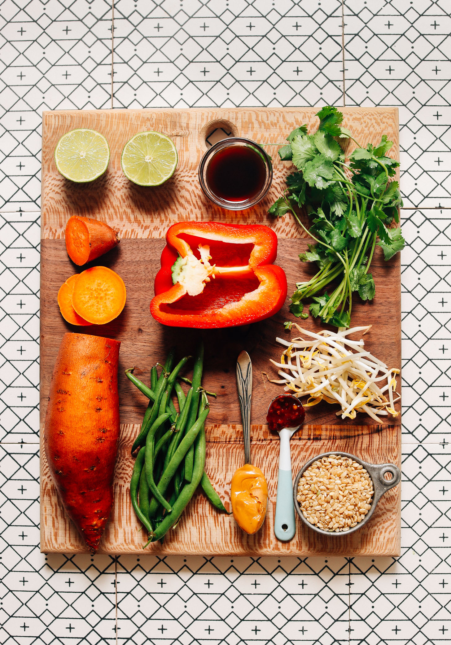 Wood cutting board filled with ingredients for making our Gado Gado with Spicy Peanut Sauce recipe