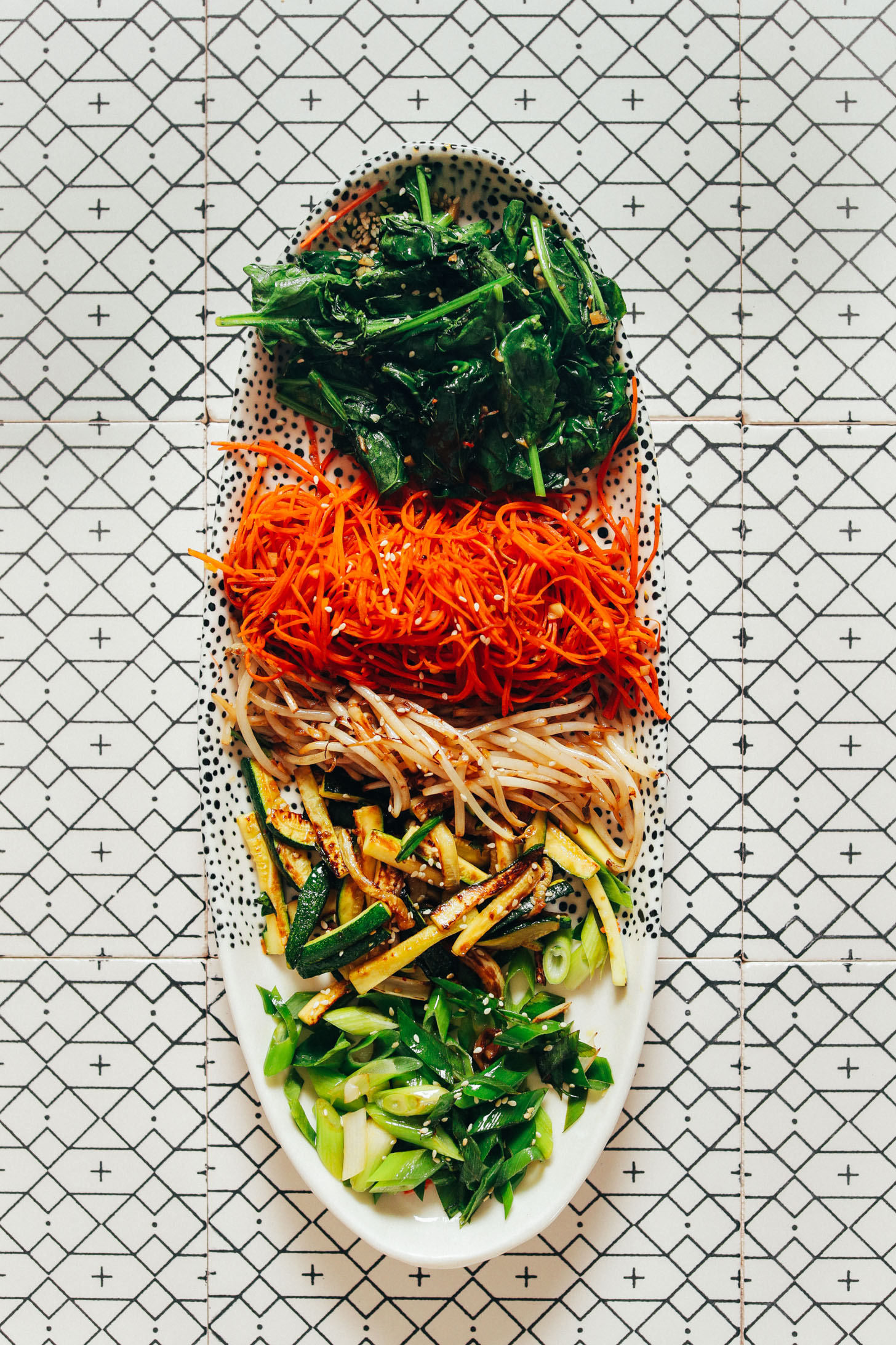 Platter of perfectly cooked vegetables for making Korean Bibimbap
