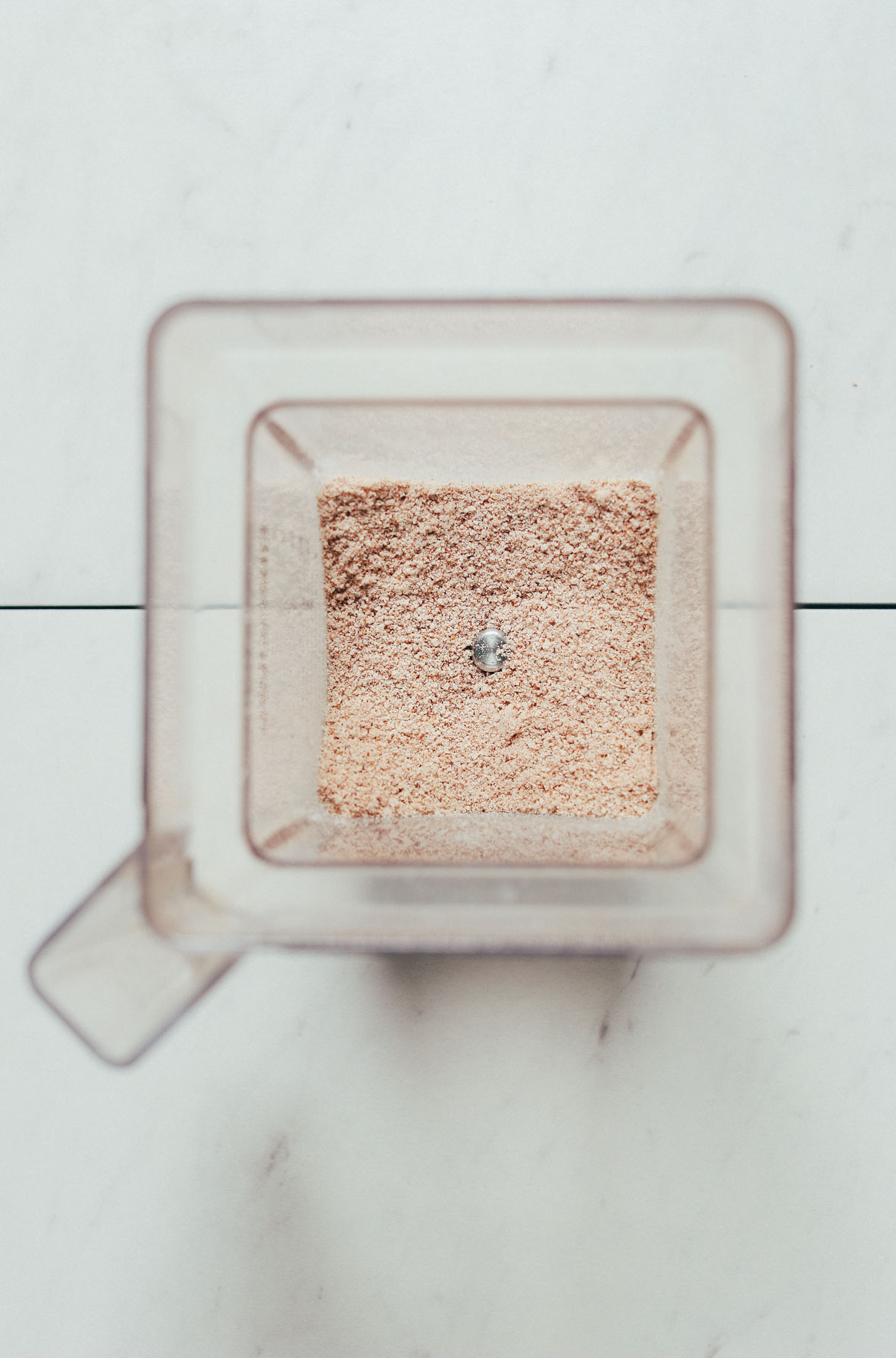 Blender filled with Almond Meal made from Leftover Almond Pulp from making nut milk
